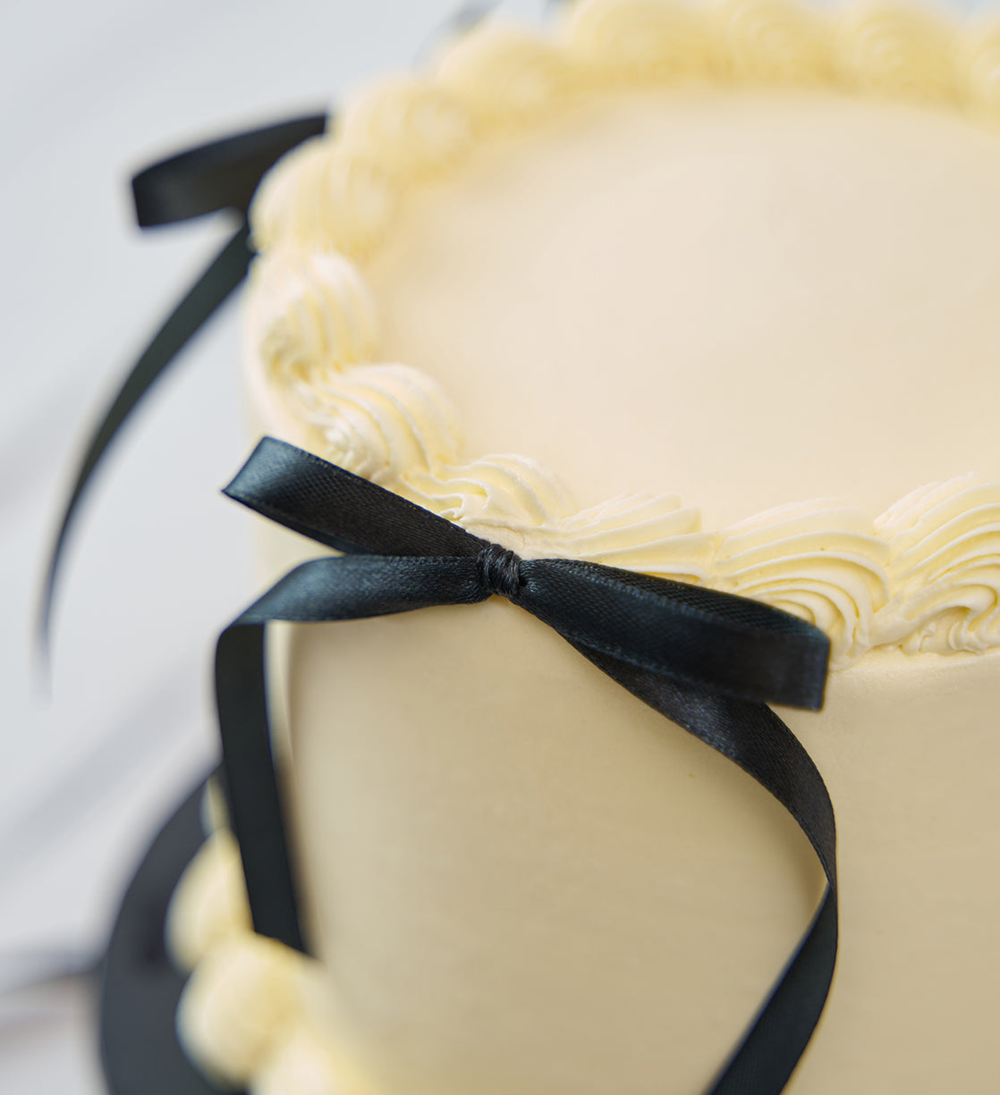 White and Black Ribbons and Ruffles Cake